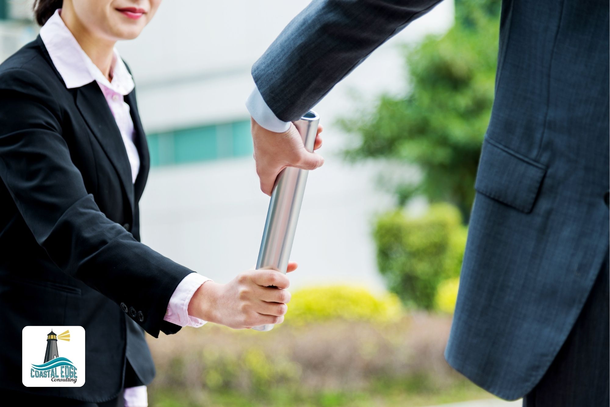 Business people passing a relay baton